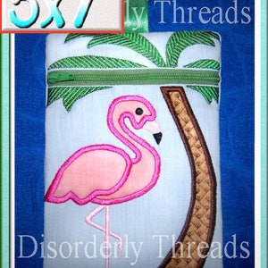 May include: Embroidered 5x7 inch design featuring a pink flamingo standing in front of a palm tree with a zipper. The design is on a white fabric with the text "Disorderly Threads" at the bottom.