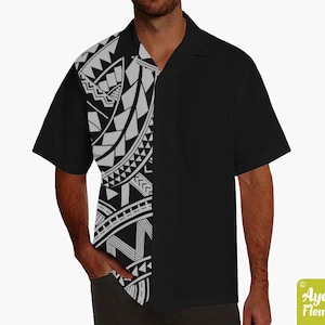 May include: A black and white patterned short-sleeved button-up shirt with a collar. The pattern is a traditional Polynesian design.