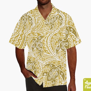May include: A white short-sleeved shirt with a gold and white patterned design. The pattern features intricate swirls and lines.