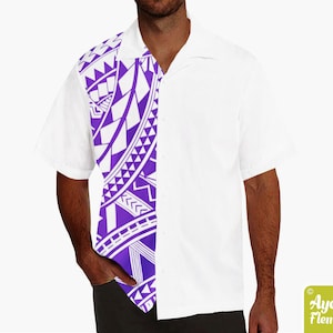 May include: A white short-sleeved button-down shirt with a purple and white geometric pattern on the left side. The pattern is reminiscent of Polynesian tribal art.