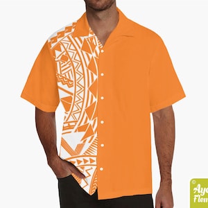 May include: Orange short-sleeve button-down shirt with a white and orange tribal pattern on the left side. The shirt has a classic collar and a row of white buttons. The brand name "Ayelet Fleming" is in the bottom right corner.