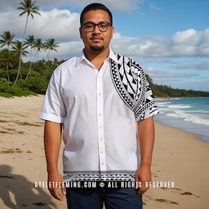 May include: A white button-down shirt with a black and white Polynesian-inspired design on the right shoulder and bottom hem. The shirt is short-sleeved and has a relaxed fit. The text "AYELETFLEMING.COM © ALL RIGHTS RESERVED." is printed on the bottom hem.