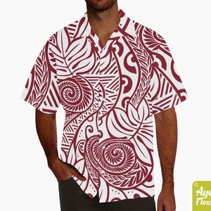 May include: A white short-sleeved button-down shirt with a maroon Polynesian-inspired pattern. The pattern features intricate swirls, leaves, and geometric shapes.