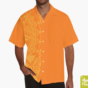 May include: A short-sleeved orange button-down shirt with a geometric pattern on the left side. The pattern is in a lighter shade of orange.
