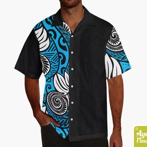 May include: A black and blue short-sleeved button-up shirt with a white and black patterned design. The pattern is on the left side of the shirt and features a swirl design.