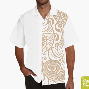 May include: White short-sleeved button-up shirt with a tan patterned design on the right side of the shirt.
