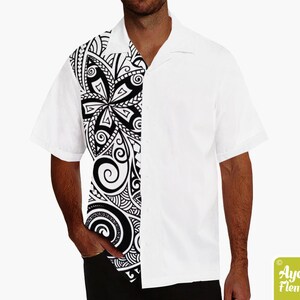 May include: A white short-sleeved button-down shirt with a black and white Polynesian-style print on the left side of the shirt.