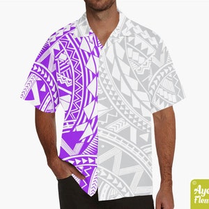 May include: A white and purple short-sleeved button-up shirt with a geometric pattern. The pattern is white on a purple background on the left side of the shirt and white on a gray background on the right side of the shirt.