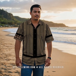 May include: A black and tan button-down shirt with a geometric pattern. The shirt has short sleeves and the word "David" is printed on the left sleeve. The shirt is worn with blue jeans. The background is a beach scene.
