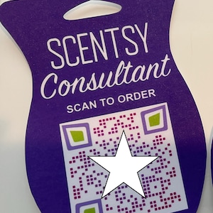 May include: Purple Scentsy Consultant sign with a white star over a QR code that says "SCAN TO ORDER".