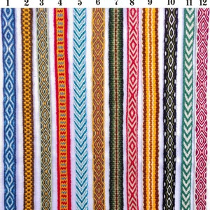 May include: Twelve different handmade woven trims in various colors and patterns, including blue, red, yellow, green, and brown. The trims are numbered 1 through 12.