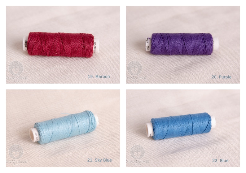 May include: Four spools of thread in different colors: maroon, purple, sky blue, and blue. The spools are labeled with numbers 19, 20, 21, and 22.