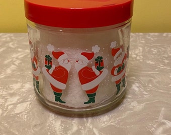 Vintage Santa Claus Holding a Present Glass Printed Anchor Hocking Jar With Red Plastic Lid