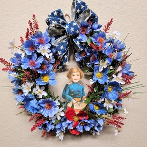 Patriotic grapevine wreath with blue poppies and Little Drummer girl sign for front door