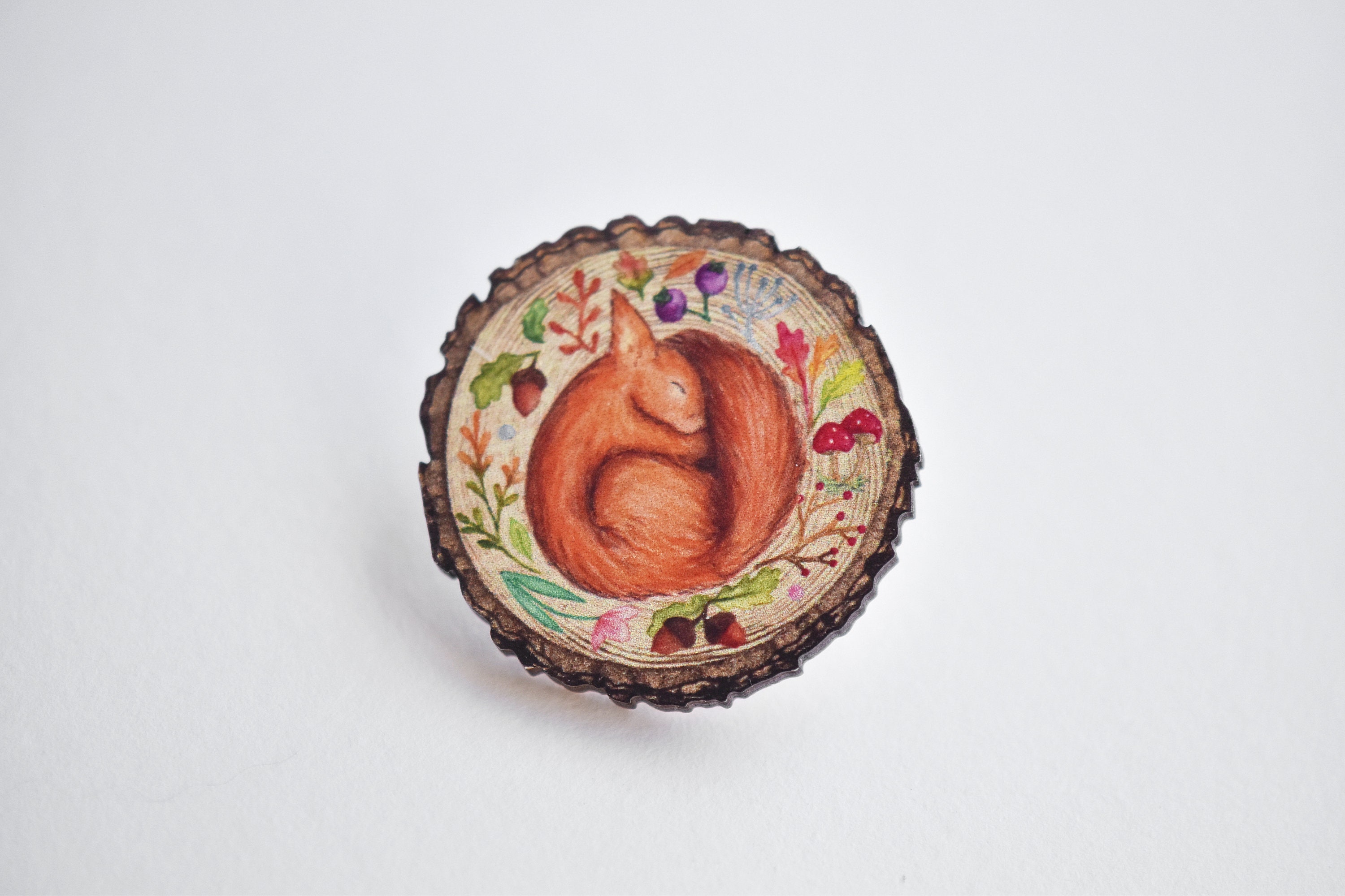 Sleeping Red Squirrel log slice pin badge, Wooden illustrated jewellery, wearable art