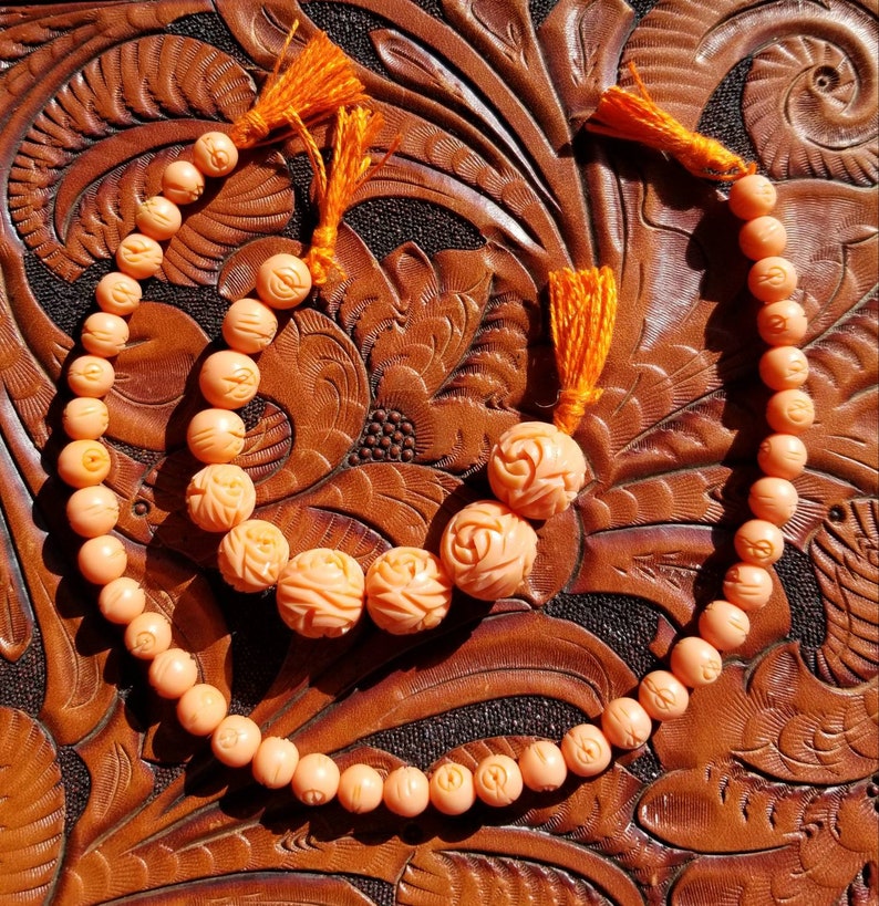 Faux coral molded plastic beads. Lovely light salmon faux coral beads