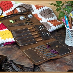 Folding leather case for crochets and interchangeable circular knitting needles.