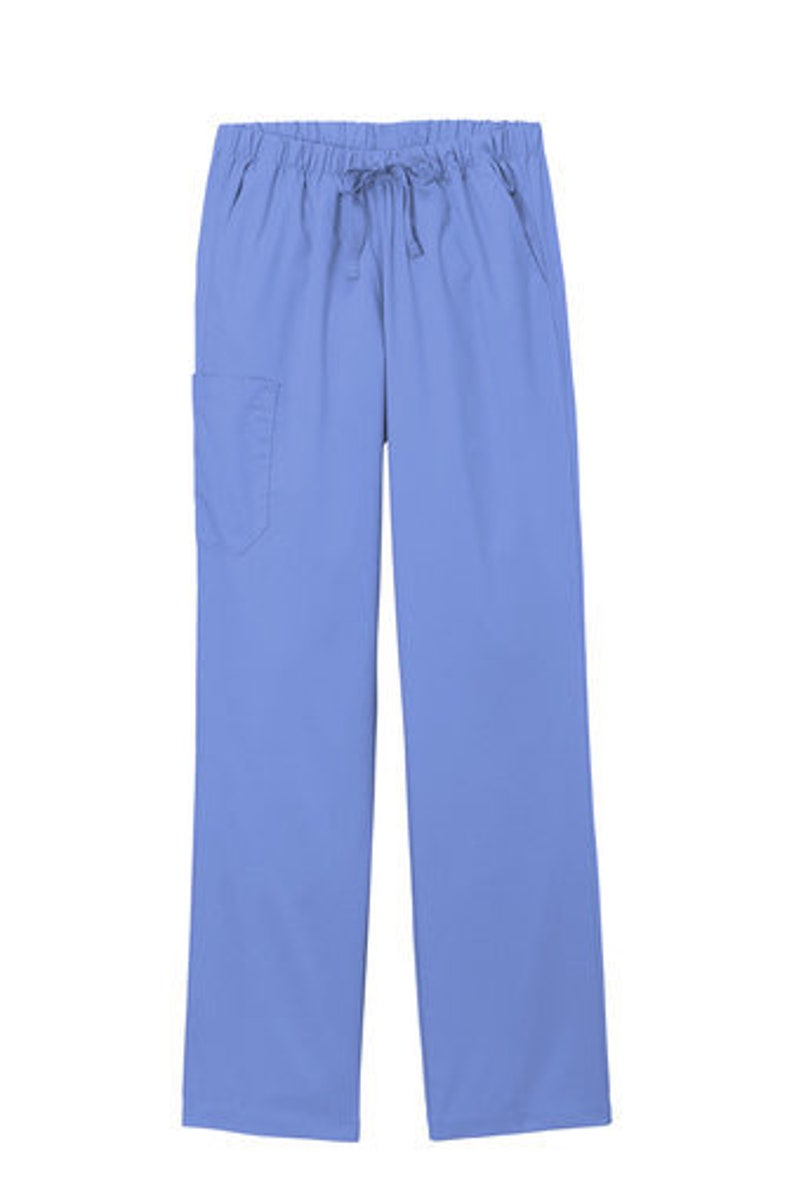 May include: Periwinkle blue scrub pants featuring an elastic waistband with a matching drawstring tie. These straight-leg trousers include two side pockets and a single patch pocket on the right thigh, providing a functional design for daily wear.