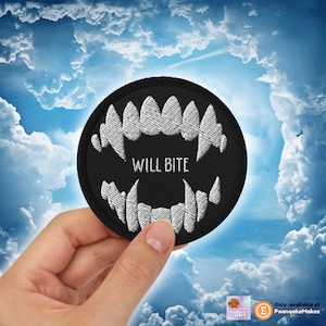 May include: A black embroidered patch with white fangs and the text "WILL BITE" in a circle.