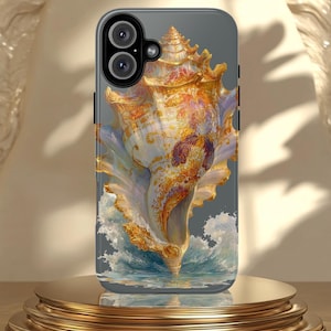 May include: A phone case featuring a detailed illustration of a seashell with gold and orange accents. The seashell is set against a gray background with a depiction of ocean waves at the base. The case has a dual-lens camera cutout.