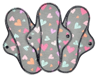 Reusable Cloth Pad - Midi Pad For Regular Flow - Cotton Flannel - 8″ to 14″ - Cute Hearts On Grey