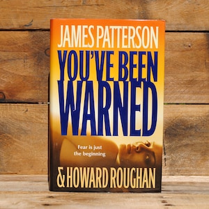 May include: A paperback book titled "You've Been Warned" by James Patterson & Howard Roughan. The cover is yellow with blue text and a photo of a person's face.