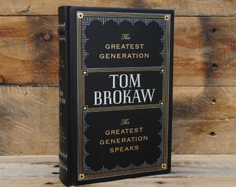 May include: A black hardcover book with gold lettering. The title is "The Greatest Generation Speaks" by Tom Brokaw.