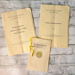 May include: Three vintage programs for the University of Oregon's 39th annual commencement. The programs are printed on yellowed paper and feature black text. The programs are for a commencement concert, failing and Beekman orations, and the university luncheon.