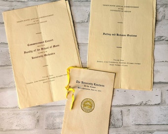 University of Oregon 1915 commencement ephemera. Alumni luncheon, oration and concert programs. 39th commencement. UO Duck.
