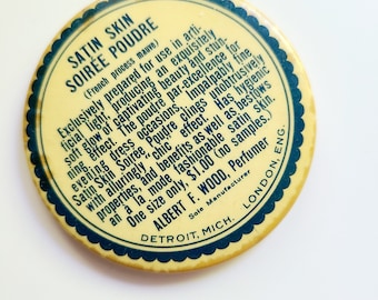 Albert F. Wood promotional pocket mirror. 2-1/8" Satin Skin Soiree Poudre. Face powder advertising. Vintage perfume, make-up collectible.