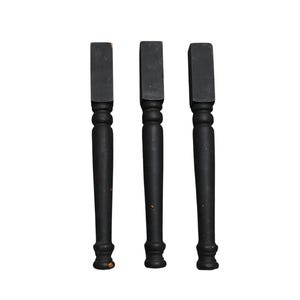 May include: Three black wooden table legs with a rectangular top and a turned, decorative design. The legs are painted black and have a slightly distressed appearance, suggesting an antique or vintage style.