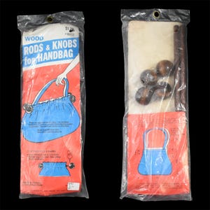 May include: Two sealed plastic bags containing wood handbag rods and knobs. The bags have a red and white background with blue text and a drawing of a blue handbag. The bags contain wooden rods and knobs.