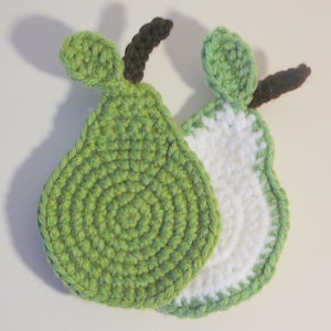 May include: Two crocheted pear-shaped coasters, one green and one white with a green border. The pears have brown stems.