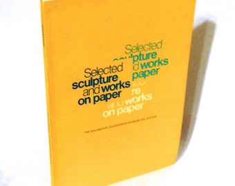May include: A yellow book cover with the title "Selected sculpture and works on paper" in blue and green text. The text is arranged in a staggered pattern.