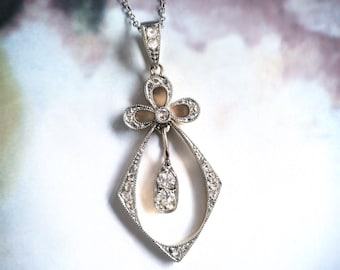 Antique Victorian .66 ctw. Diamond Bow Pendant Platinum 18K