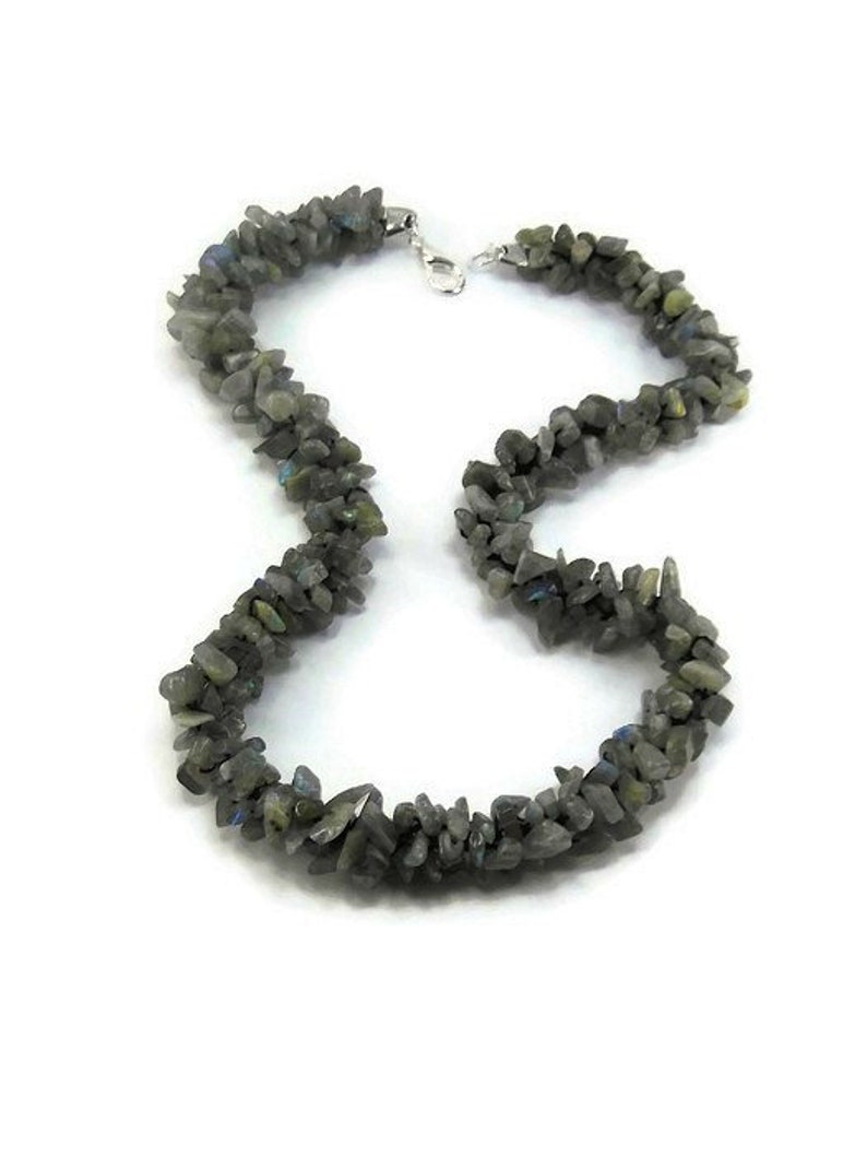 May include: A silver chain necklace with a long strand of dark gray labradorite gemstone chips.