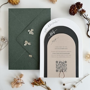 May include: A wedding invitation with a modern arch design. The invitation is printed on cream paper with black and white accents. The text on the invitation reads "together with their families" and "rsvp". The invitation also includes a QR code and the date "31st of October 2024".