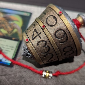 Classic finish with red cord and red gems