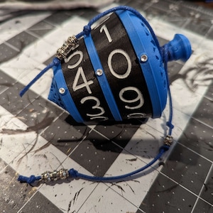 Chromatic collection. 
Dials - Black
Numbers - White
Top/Bottom/Core - Blue
Gem/Cord - Blue