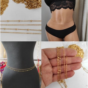 May include: Gold chain body jewelry with small round beads. The chain is shown on a model and laid out flat.