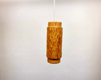 Cord pendant or light pull in irish yew wood with a textured panel, sizes 80mm x32mm