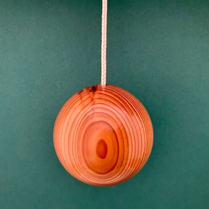 Light pull or cord pull hand made in Irish or Celtic Yew in a ball shape measuring 43mm in diameter, home and living accessory.