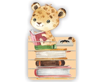 May include: A watercolor illustration of a leopard reading a book on a stack of books. The leopard is sitting on the top book and is holding a pink book in its paws. The books are stacked on a shelf with a light brown background.