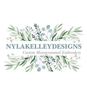 May include: A logo for a business called "NyLakeLleyDesigns" that specializes in custom monogrammed embroidery. The logo features a watercolor design of green and blue foliage.