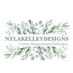 May include: A logo design featuring the text "NYLAKELLEYDESIGNS" in a teal font, with the tagline "Custom Monogrammed Embroidery" below. The text is framed by watercolor-style green and blue-green botanical illustrations.
