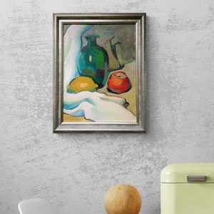 Discover the beauty of our vibrant still life original oil painting, a stunning piece of framed artwork that brings a touch of vintage charm to any space. This one of a kind hand-painted canvas features an exquisite arrangement of fruits and a bottle, captured in an impressionist style that radiates color and warmth. Whether you're looking to enhance your kitchen decor or add a focal point to your dining area, this unique art piece serves as a delightful addition to your home.