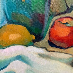 Discover the beauty of our vibrant still life original oil painting, a stunning piece of framed artwork that brings a touch of vintage charm to any space. This one of a kind hand-painted canvas features an exquisite arrangement of fruits and a bottle, captured in an impressionist style that radiates color and warmth. Whether you're looking to enhance your kitchen decor or add a focal point to your dining area, this unique art piece serves as a delightful addition to your home.