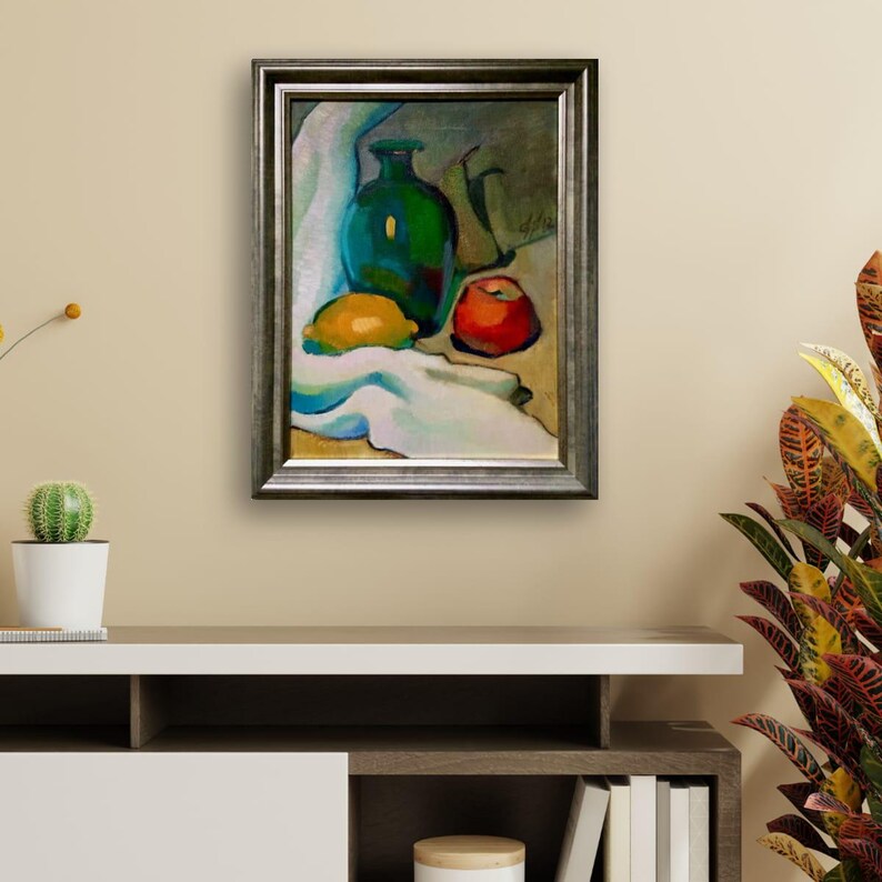 Discover the beauty of our vibrant still life original oil painting, a stunning piece of framed artwork that brings a touch of vintage charm to any space. This one of a kind hand-painted canvas features an exquisite arrangement of fruits and a bottle, captured in an impressionist style that radiates color and warmth. Whether you're looking to enhance your kitchen decor or add a focal point to your dining area, this unique art piece serves as a delightful addition to your home.