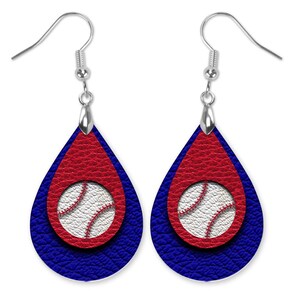 May include: A pair of teardrop-shaped earrings with a red and blue leather design. The earrings feature a white baseball with red stitching in the center.