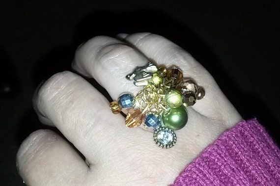 Hanging charms ring
